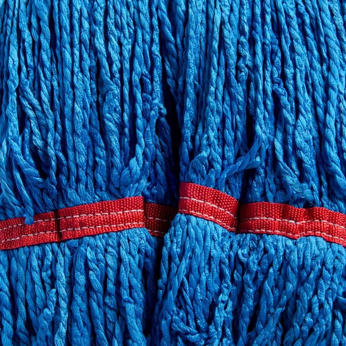 Close-up of blue microfiber mop yarn strands with red tie band showing texture and construction detail