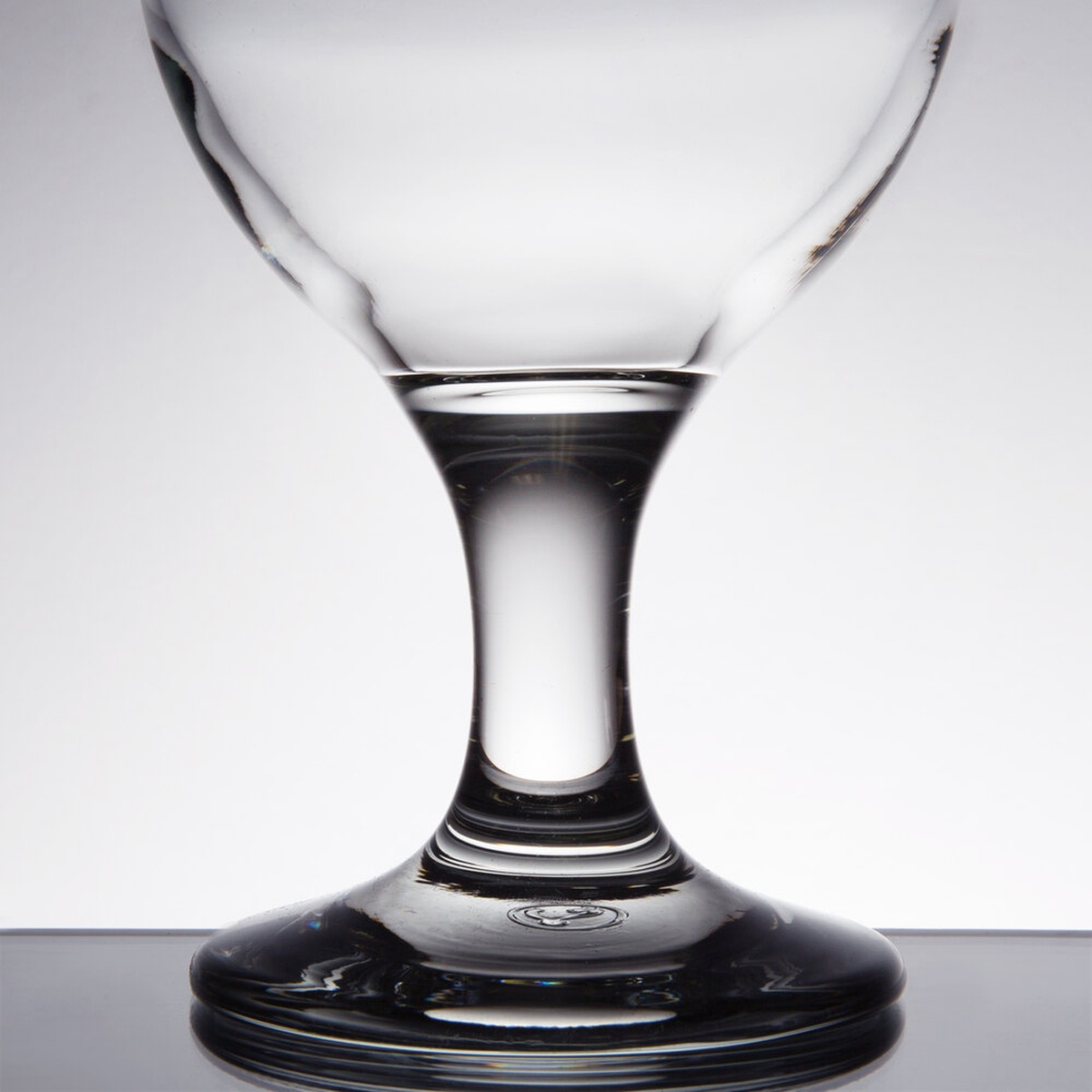 Close-up of the Libbey Embassy goblet thick stem and chip-resistant base on a reflective surface