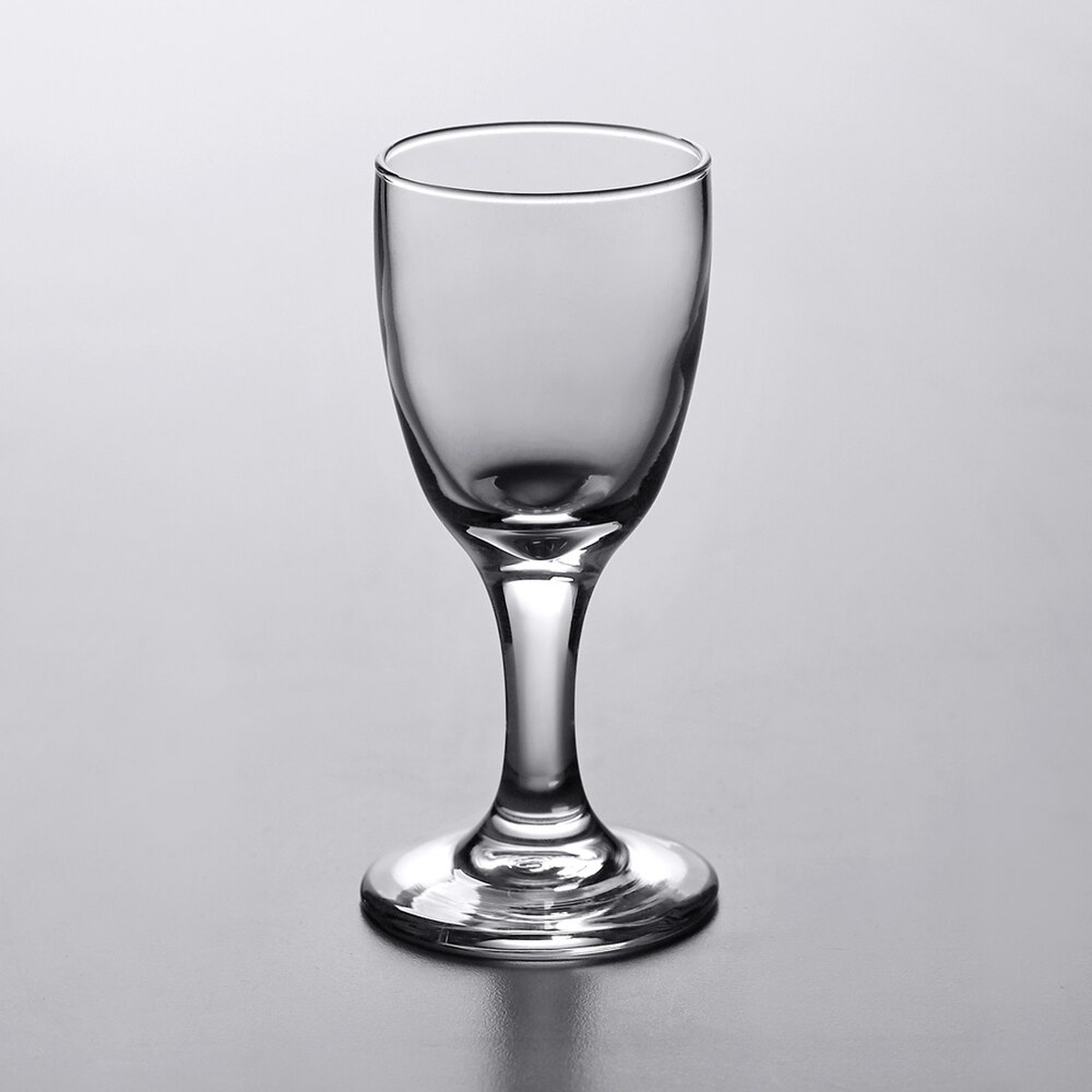 Libbey 3788 Embassy 3 oz. sherry glass, clear, with rounded bowl and short stem on neutral background