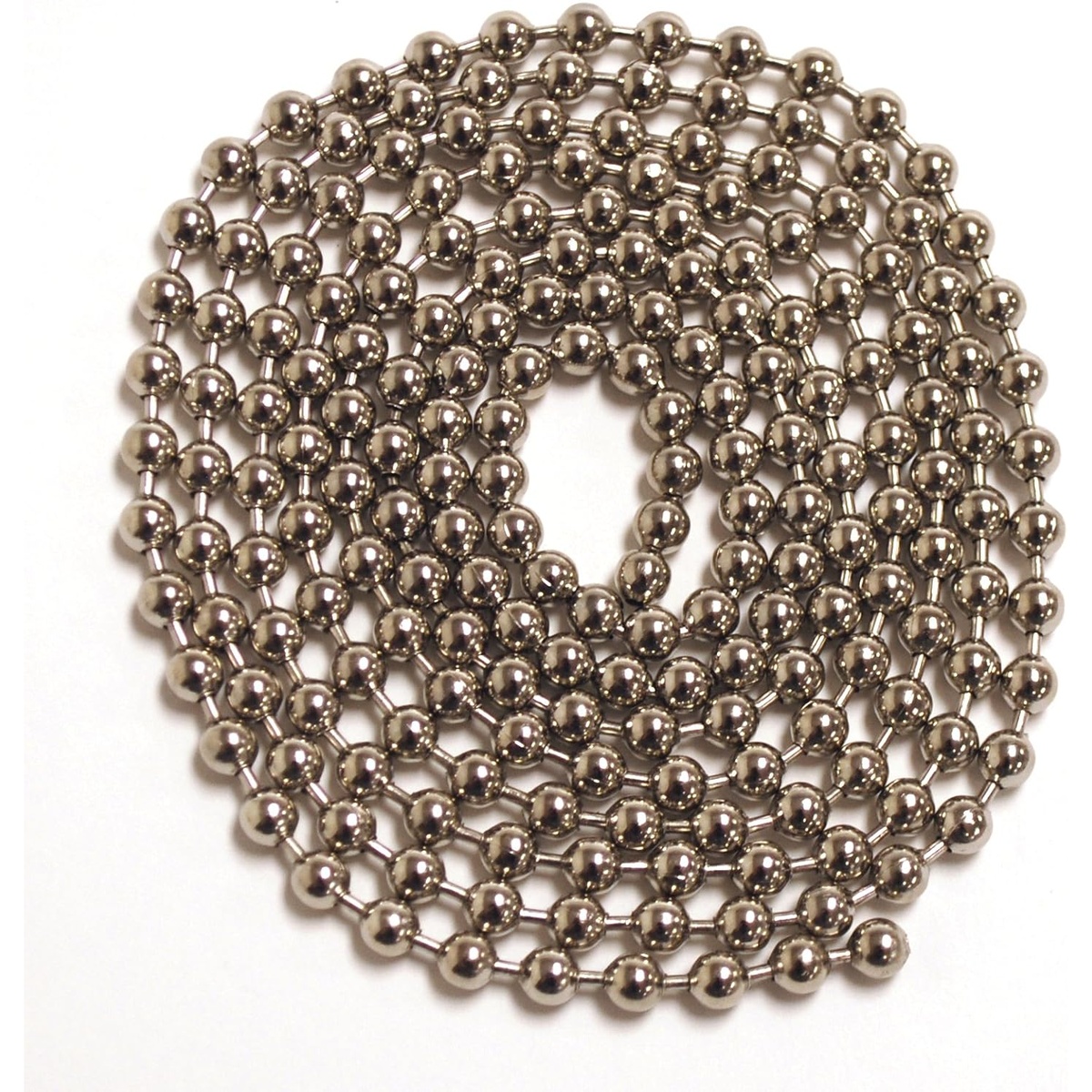 Close-up of the Norpro stainless steel pie crust weight chain coiled on a white surface