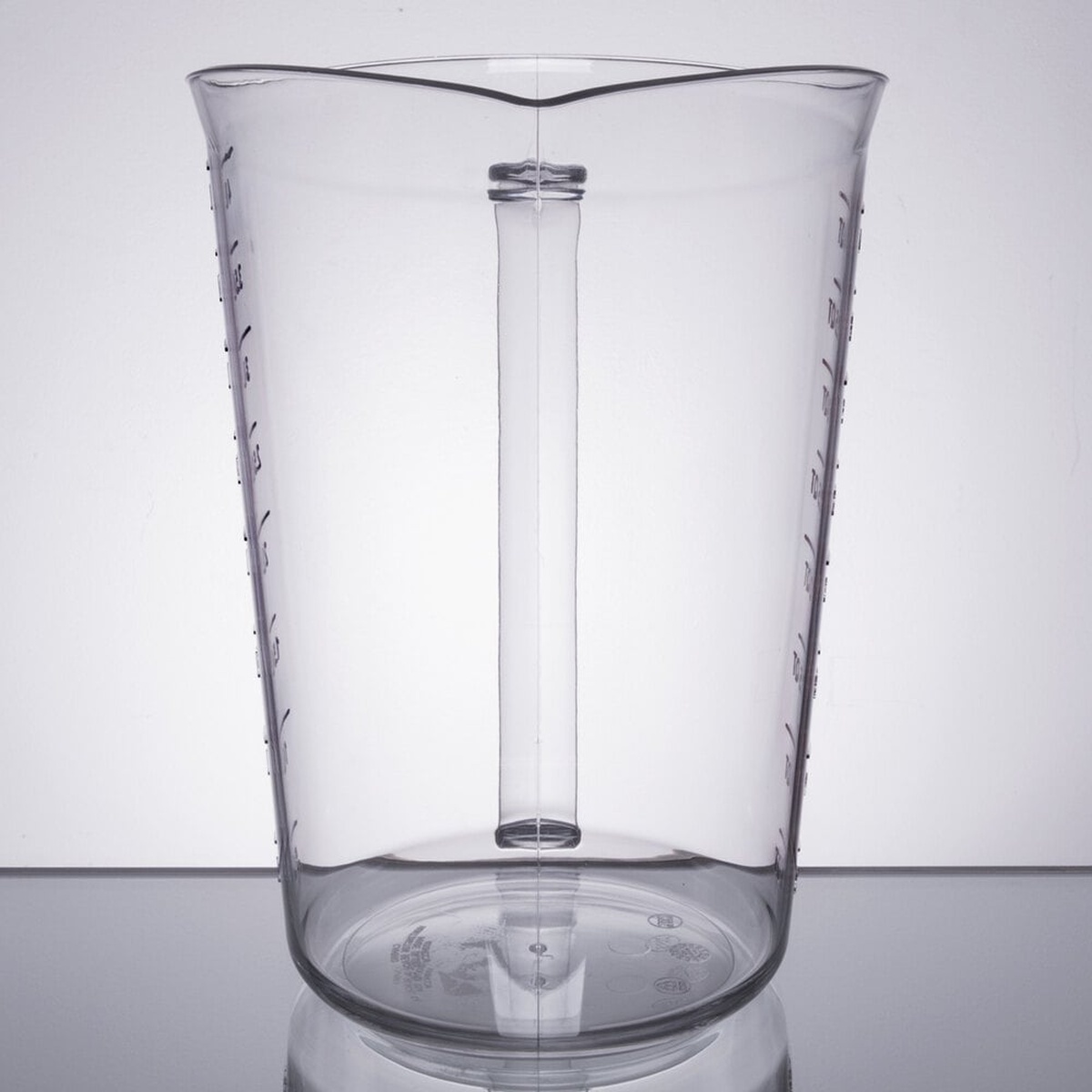 Front view of Cambro 4-quart clear polycarbonate measuring cup showing wide tapered body, dual pour spouts, and graduated markings on both sides