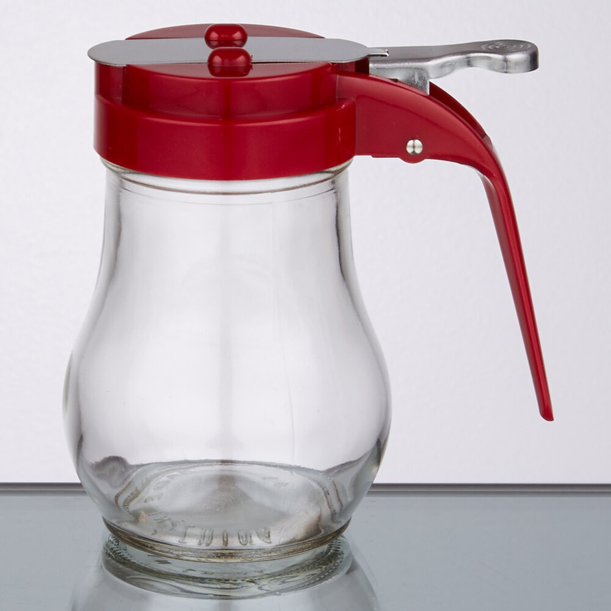 TableCraft 406RE 6 oz. teardrop glass syrup dispenser with red ABS top and chrome thumb lever