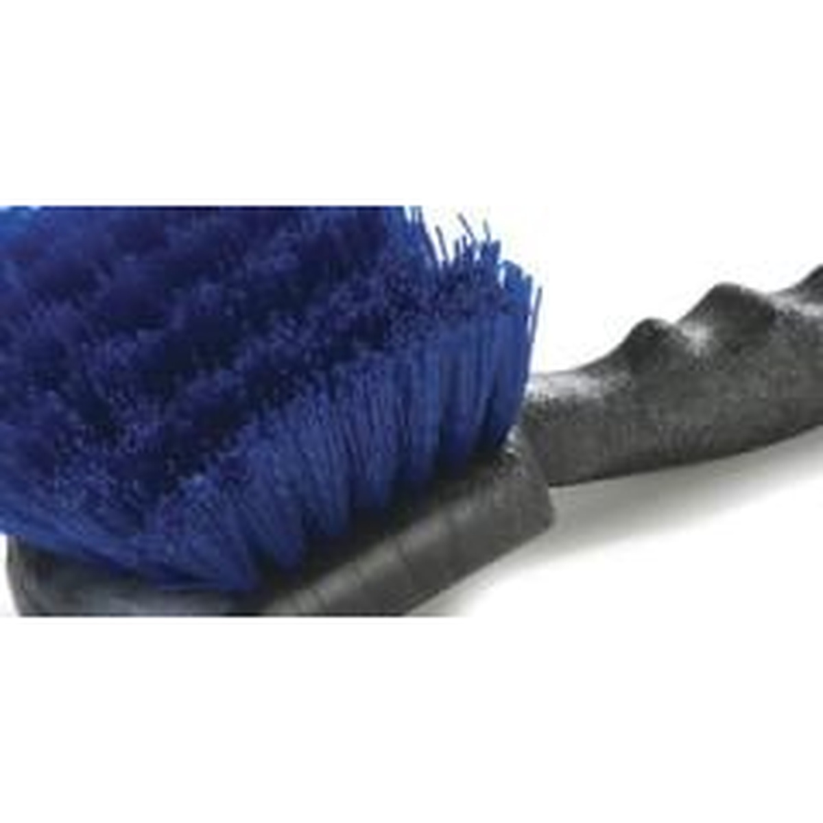 Close-up of blue polyester bristles on a floor sweep brush showing fine and coarse bristle construction
