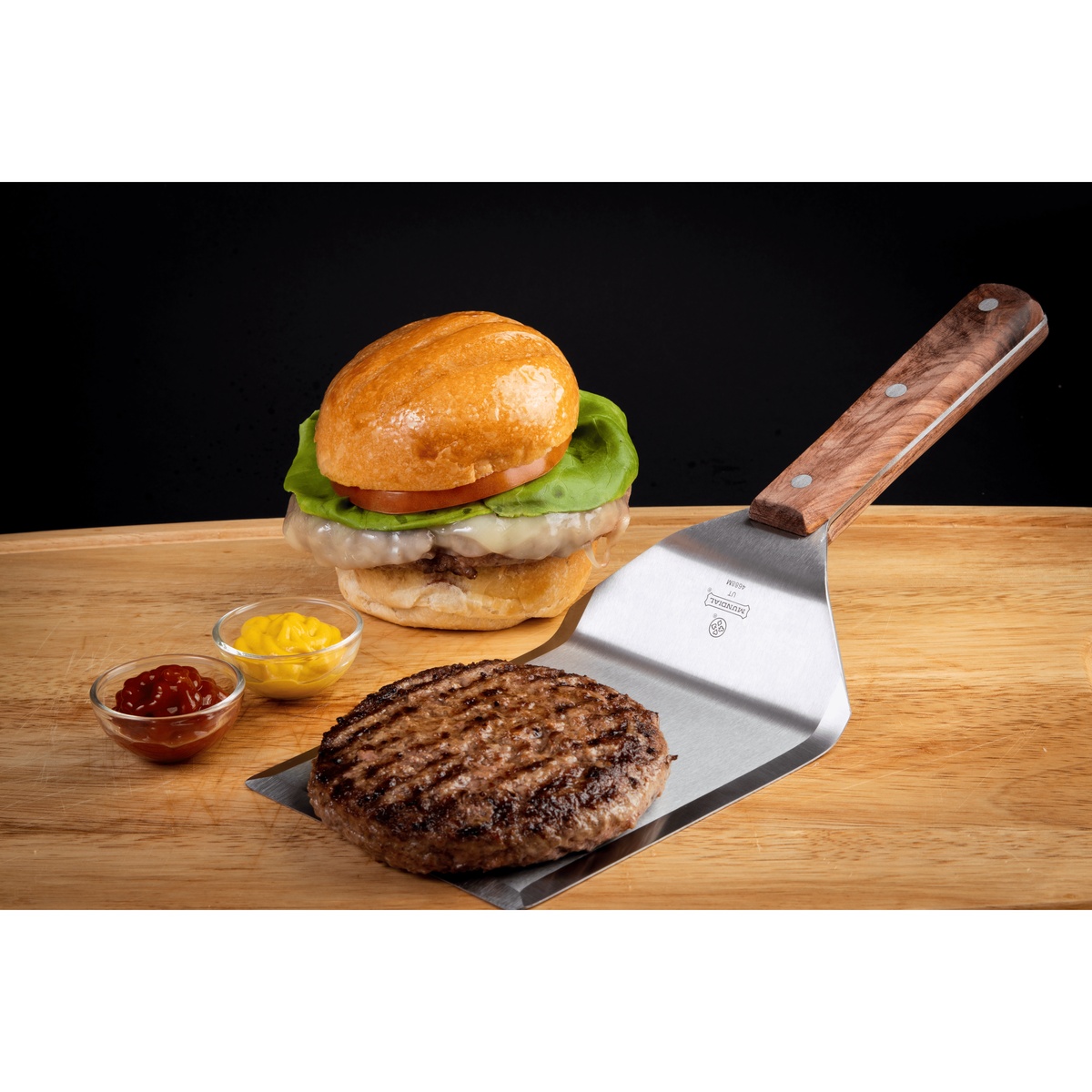 Mundial 4688M turner spatula full product view showing blade and wood handle assembly