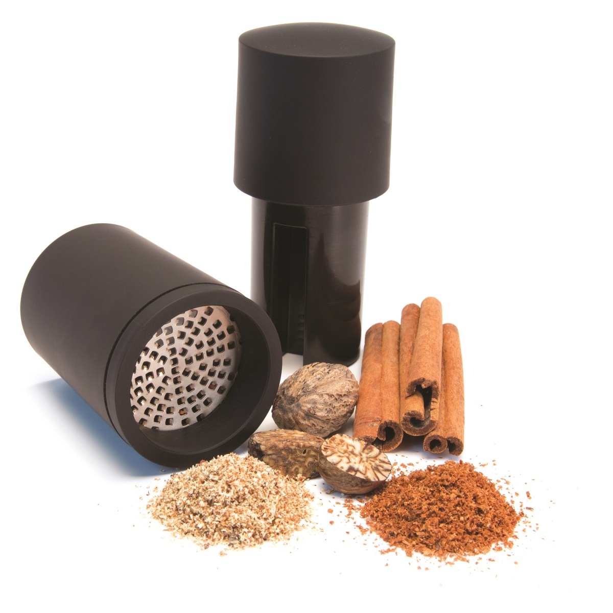 Microplane spice mill disassembled showing the sharp stainless steel blade and ground nutmeg