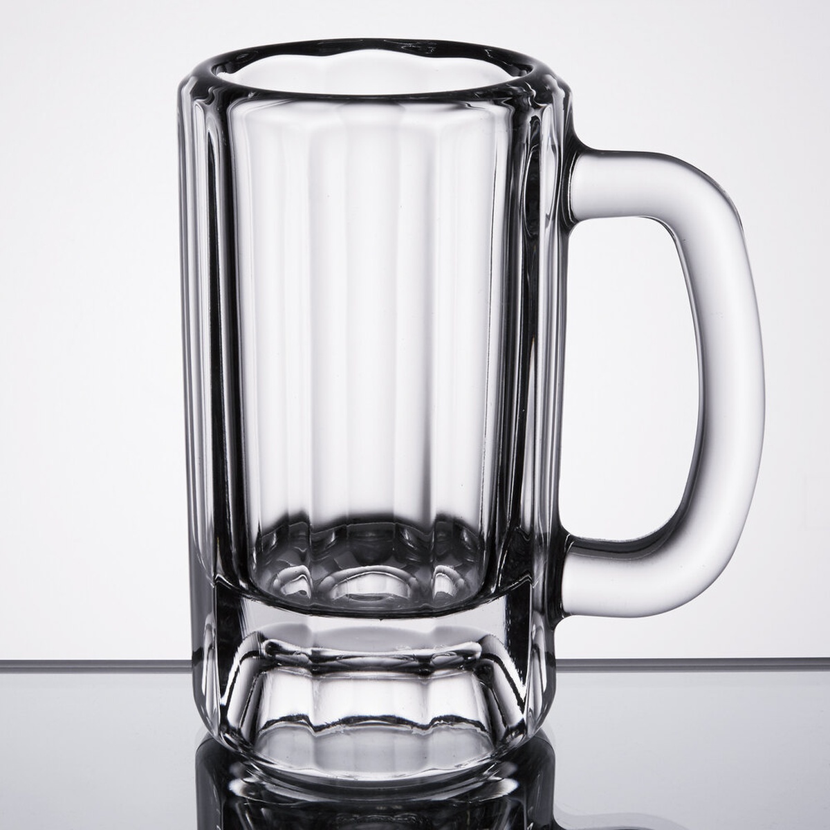 Libbey 5016 12 oz. clear paneled glass beer mug with handle and large hollow base