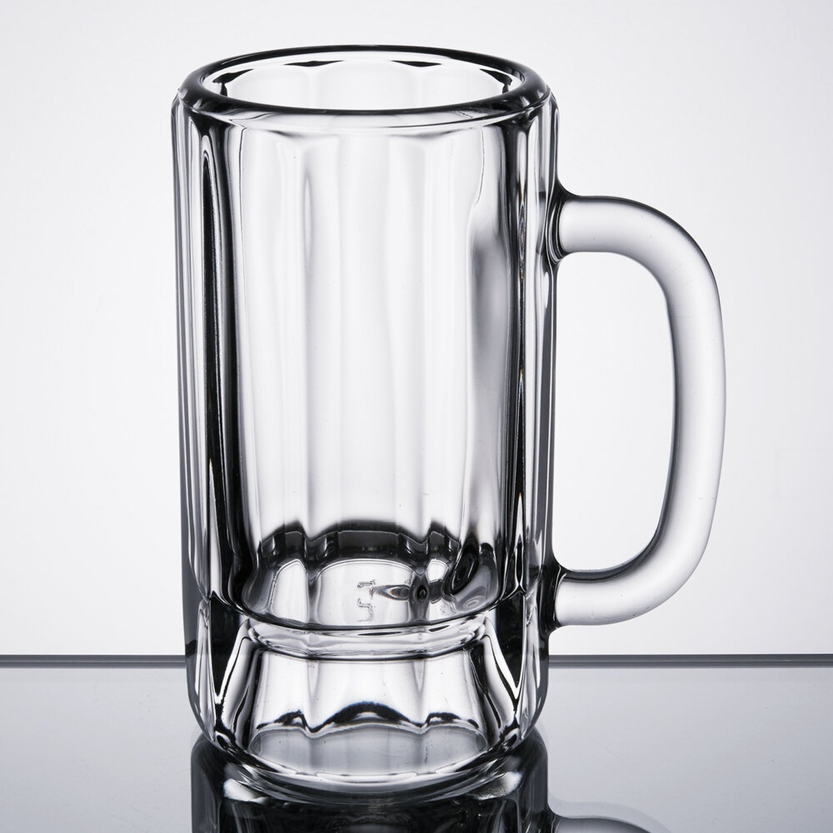Libbey 5018 14 oz clear paneled beer mug with handle, showing thick walls, vertical panels, and large hollow base