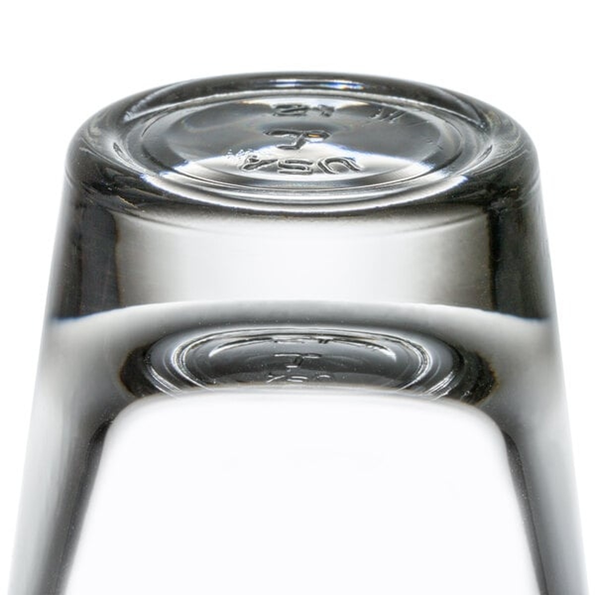 Close-up of the thick heavy base of the Libbey 5120/A0007 shot glass showing USA marking molded into the glass bottom