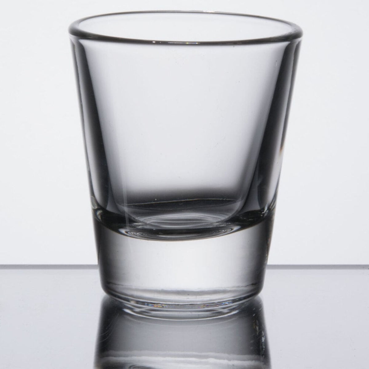 Libbey 5120 1.5 oz whiskey shot glass, full view on reflective surface