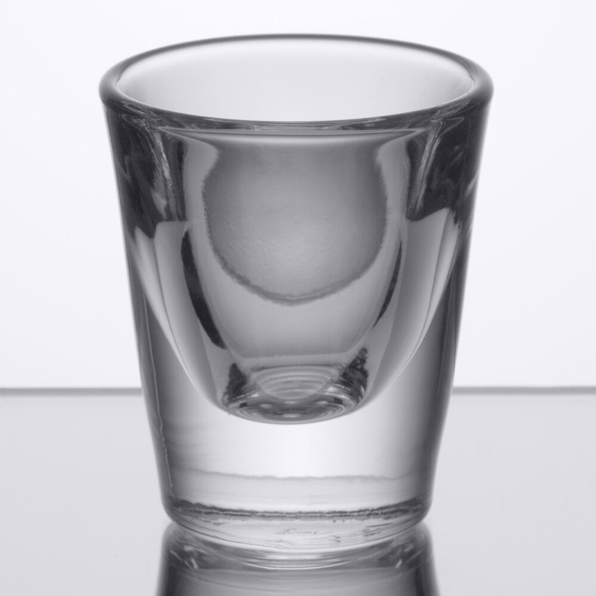 Libbey 5122 1 oz. clear whiskey shot glass with thick base and wide mouth opening
