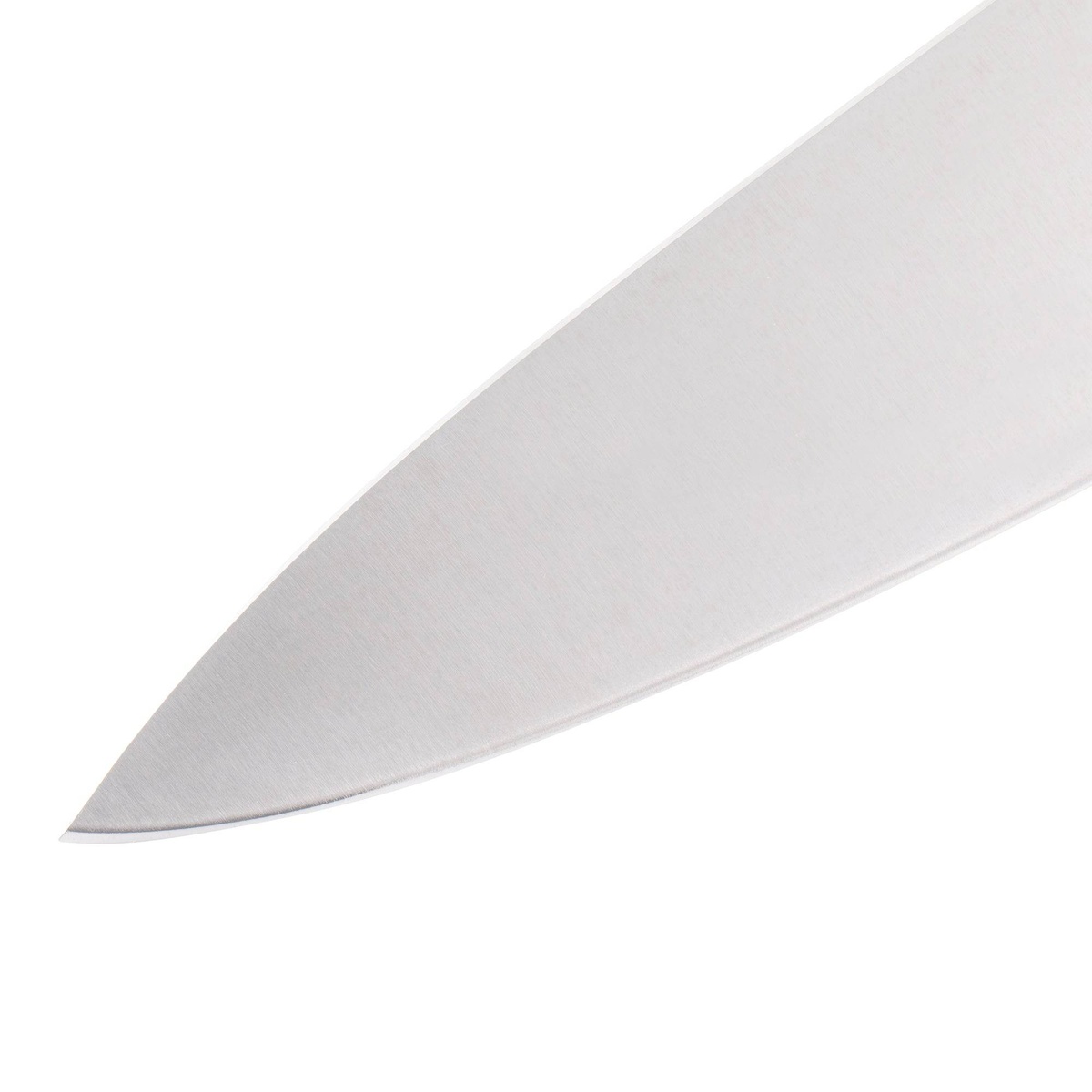 Close up of chef knife blade tip showing edge and finish