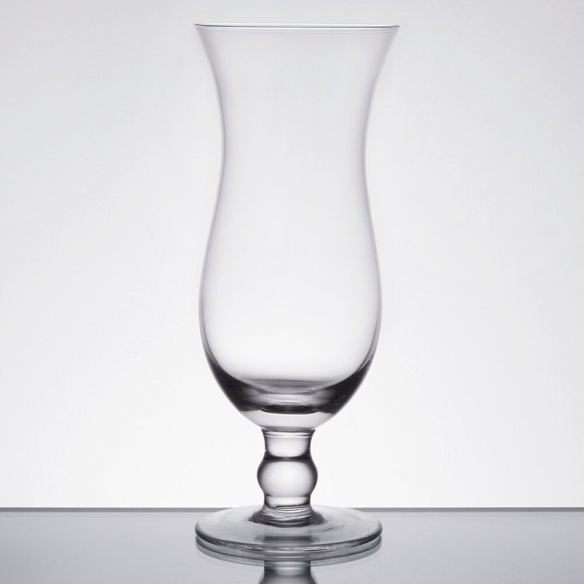 Anchor Hocking 524UX 15 oz clear footed hurricane glass with bulbed stem and broad base