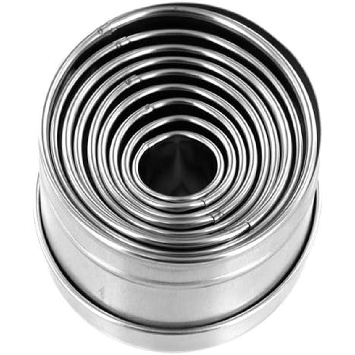 Top-down view of nine Ateco plain oval stainless steel cutters nested concentrically inside their storage tin