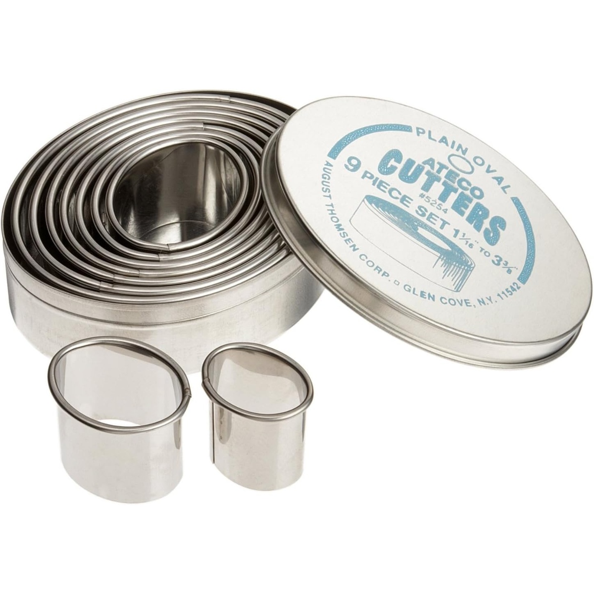 Ateco 5254 nine plain oval stainless steel cutters displayed next to their storage tin with two individual cutters shown in front
