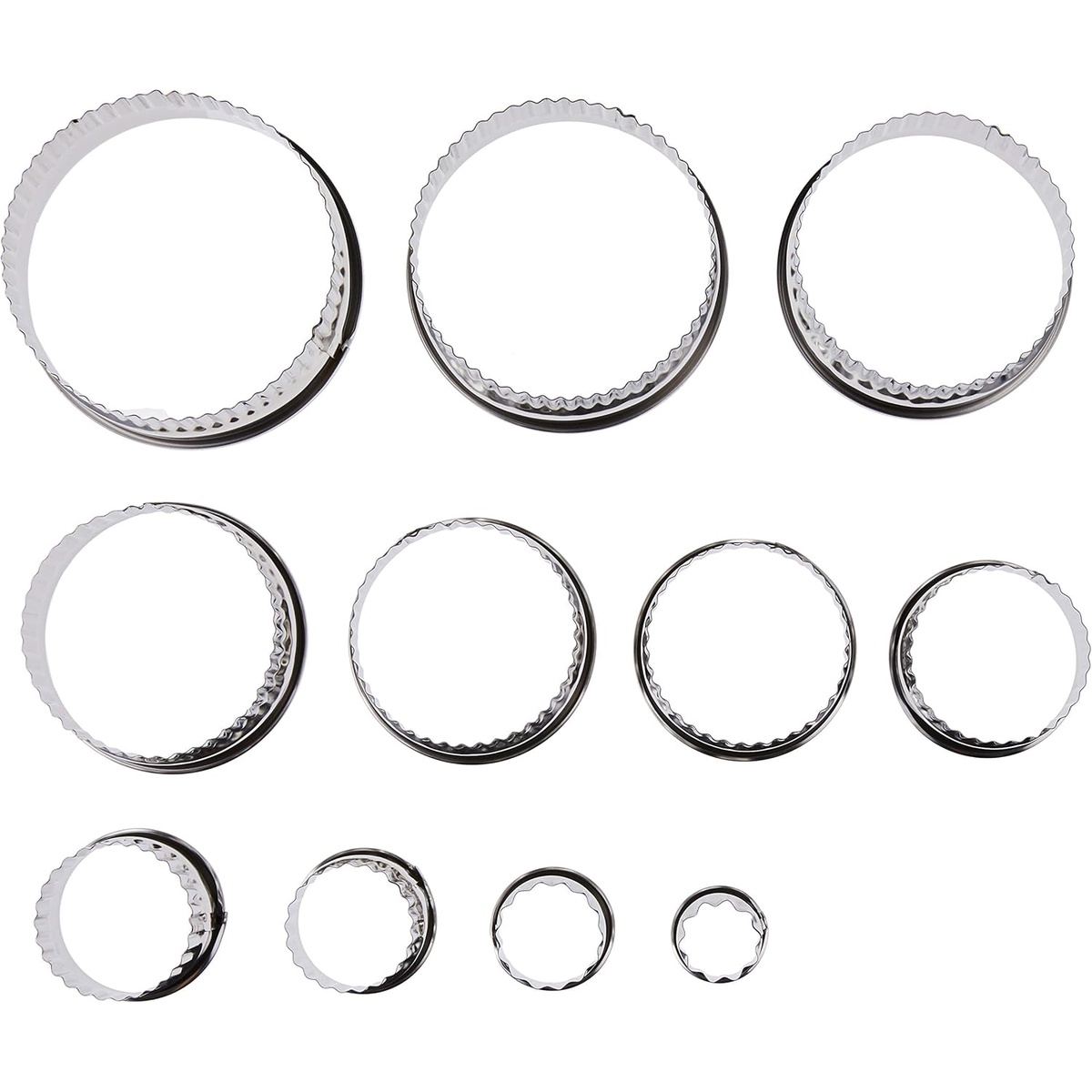 All 11 Ateco fluted round stainless steel cutters laid out in graduated sizes on white background