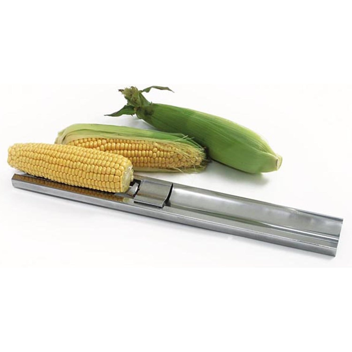 Norpro stainless corn cutter placed alongside fresh corn on the cob, both husked and unhusked