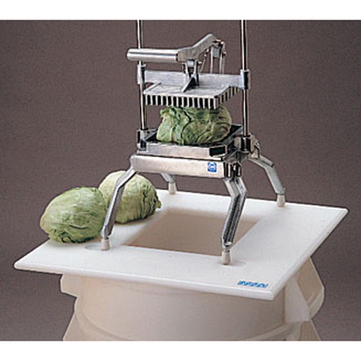 Close-up view of Nemco Easy LettuceKutter showing blade assembly and lettuce cutting action with optional support board