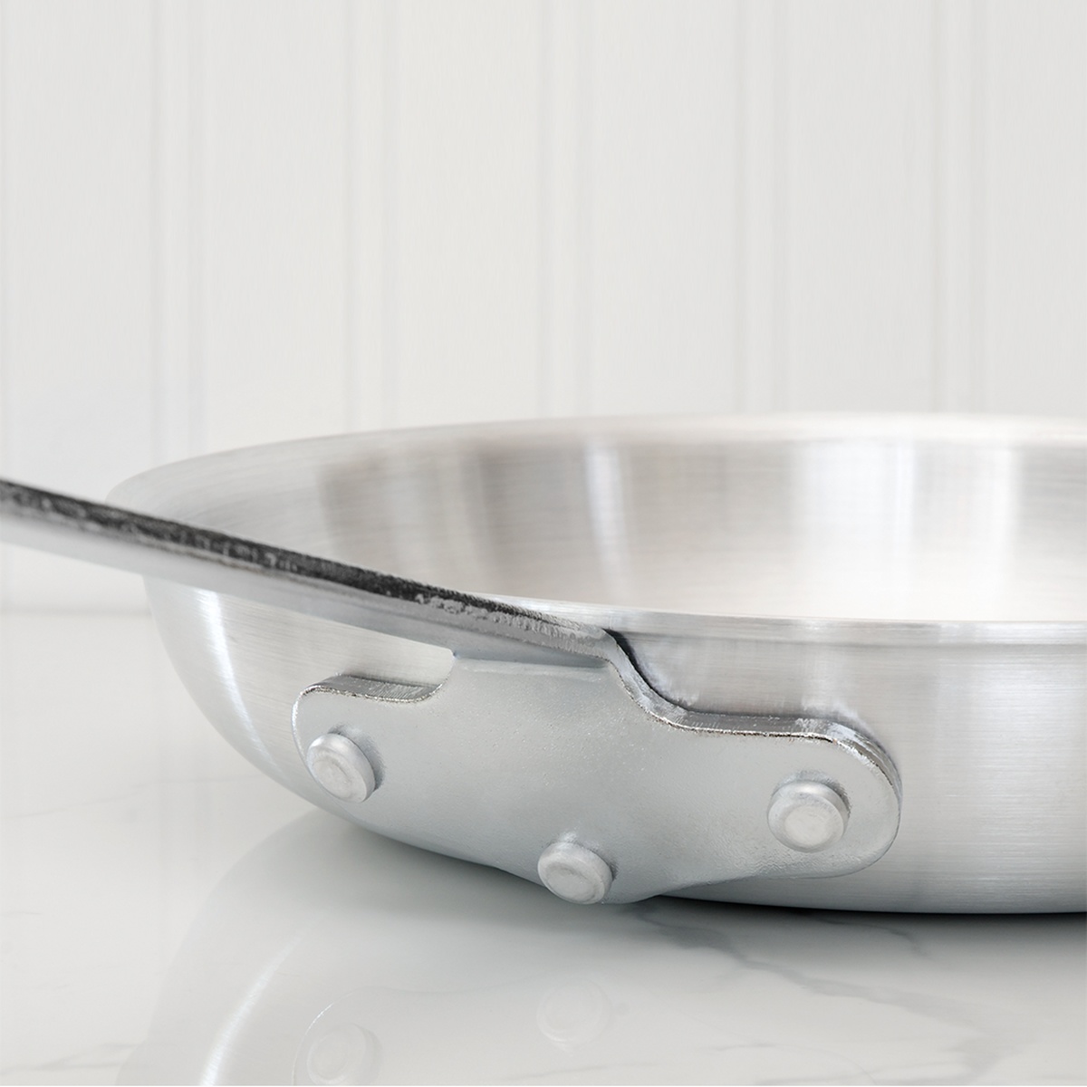 Close up of the heavy duty riveted handle on the Browne fry pan