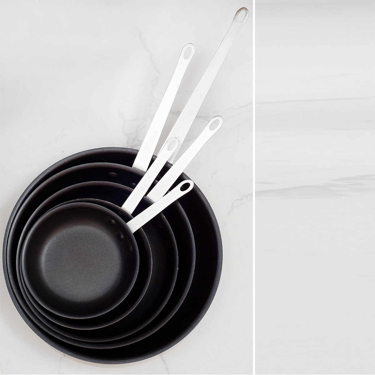 Stack of multiple Browne Thermalloy non-stick aluminum fry pans in various sizes