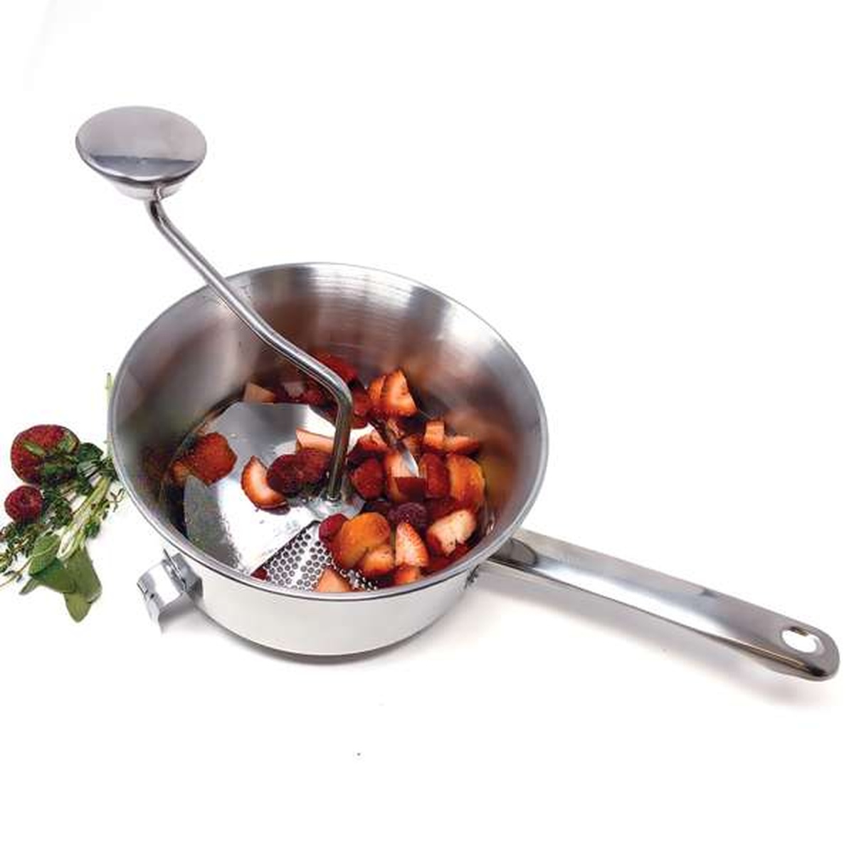 Stainless steel food mill with fresh strawberries inside