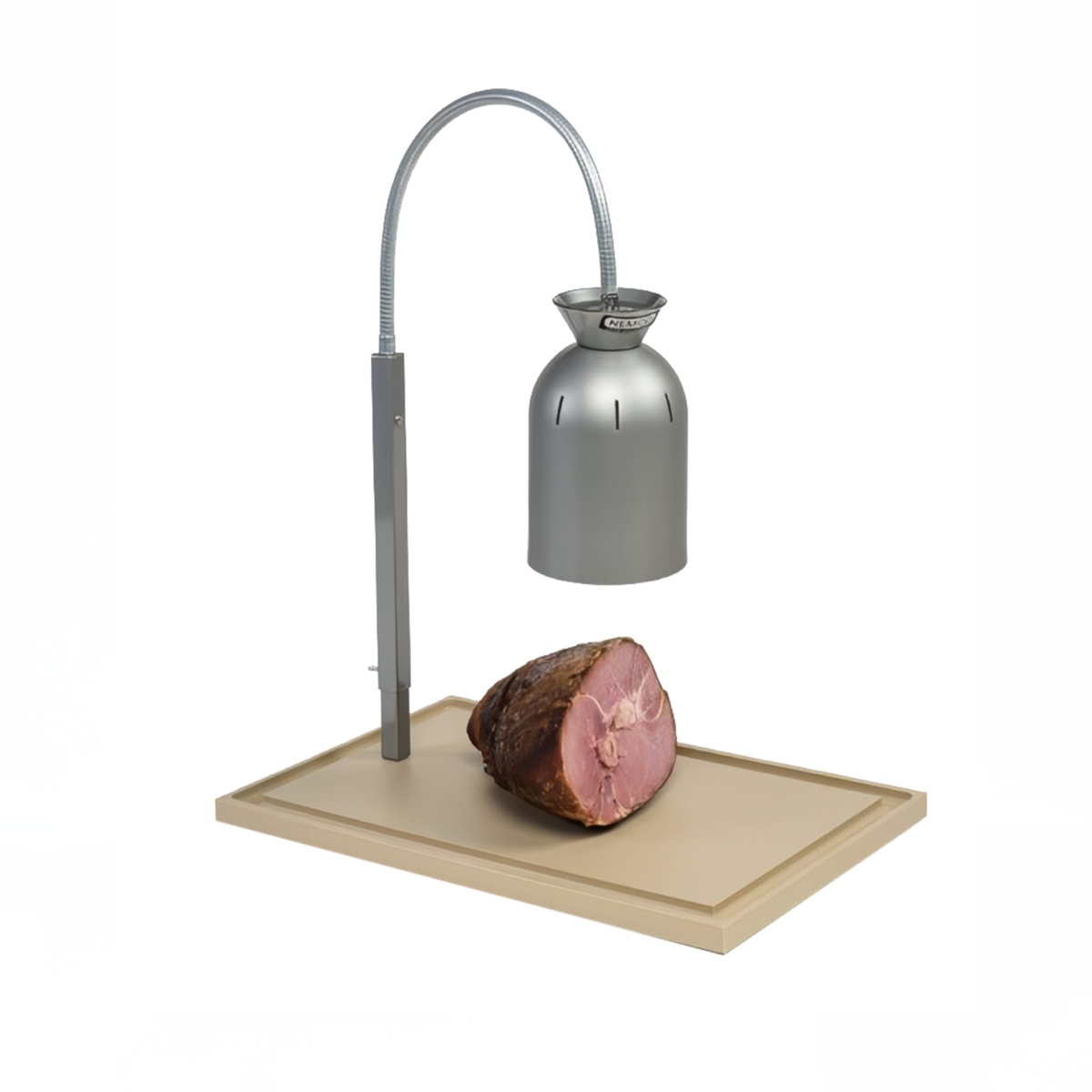 Nemco 6015 carving station with a carved ham resting on the polyethylene cutting board beneath the infrared lamp