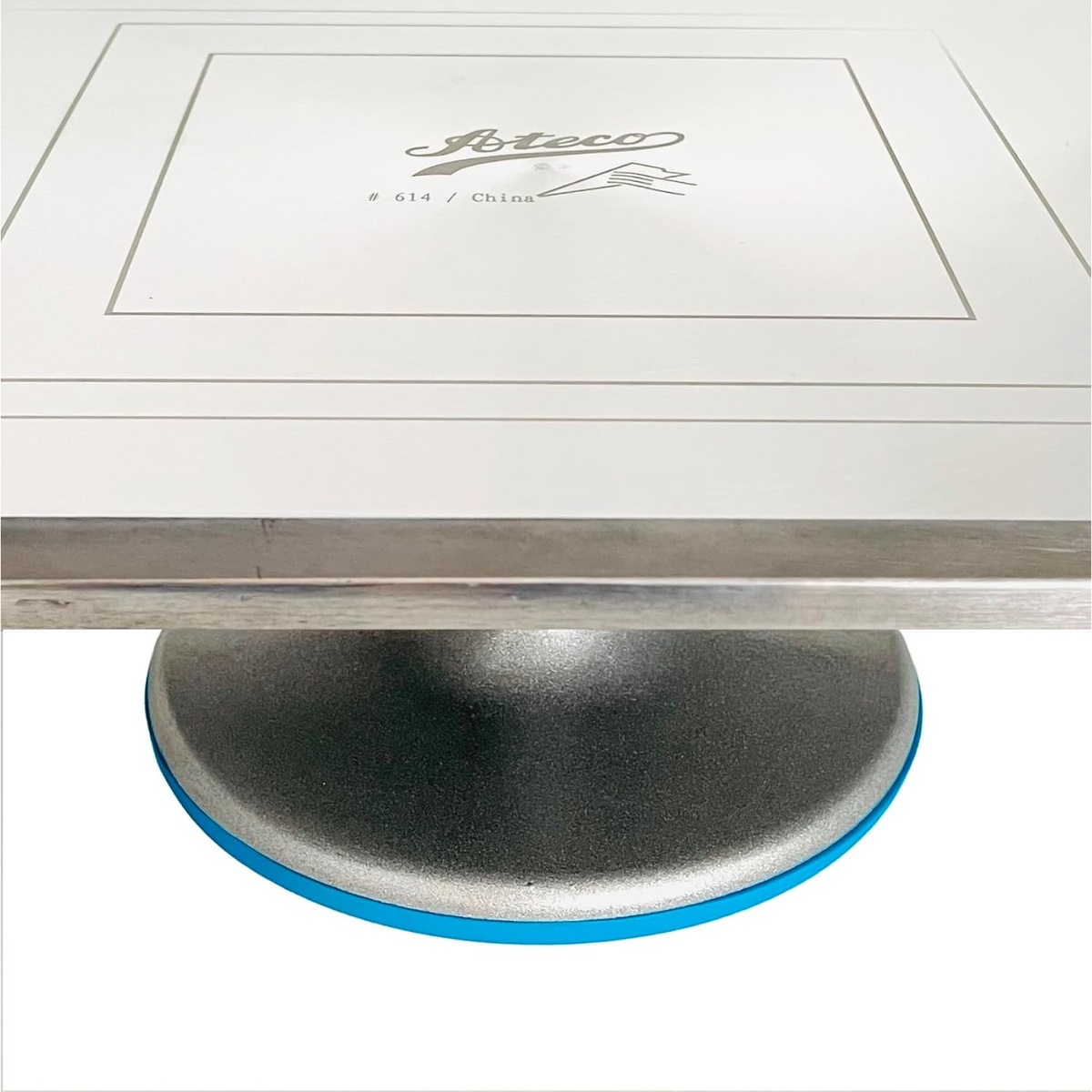 Close-up of Ateco 614 turntable top surface showing engraved centering markings and Ateco branding with the aluminum base below
