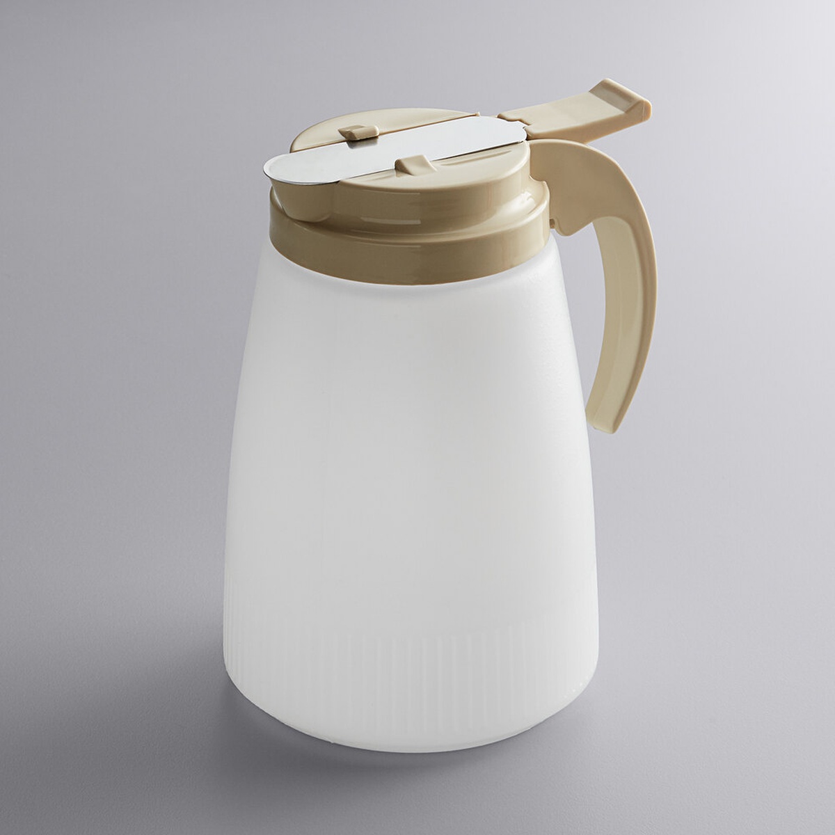 Vollrath Dripcut 32 oz white polyethylene syrup server with almond plastic top and large handle