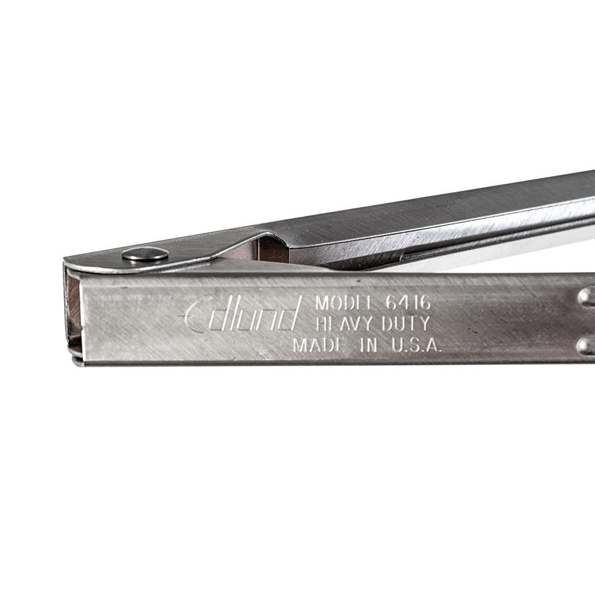 Close-up of Edlund Model 6416 Heavy Duty tong hinge area stamped with brand name and Made in U.S.A. marking