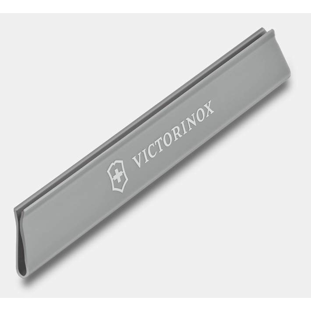 Victorinox gray blade guard shown at an angle, displaying its channel profile and branding