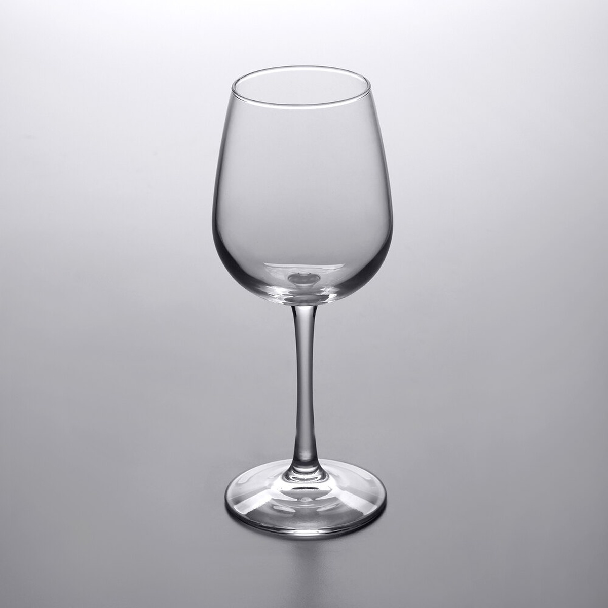 Libbey 7508 Vina 12.75 oz. clear wine taster glass with thin stem and wide foot on a gray background