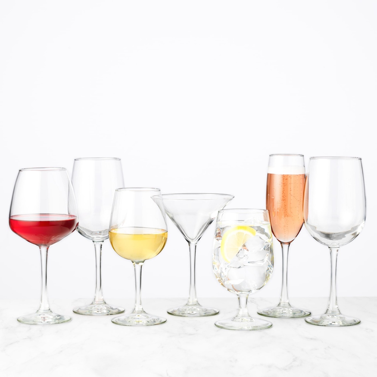 Libbey Vina glassware collection including balloon wine, white wine, martini, champagne flute, and goblet styles on white background