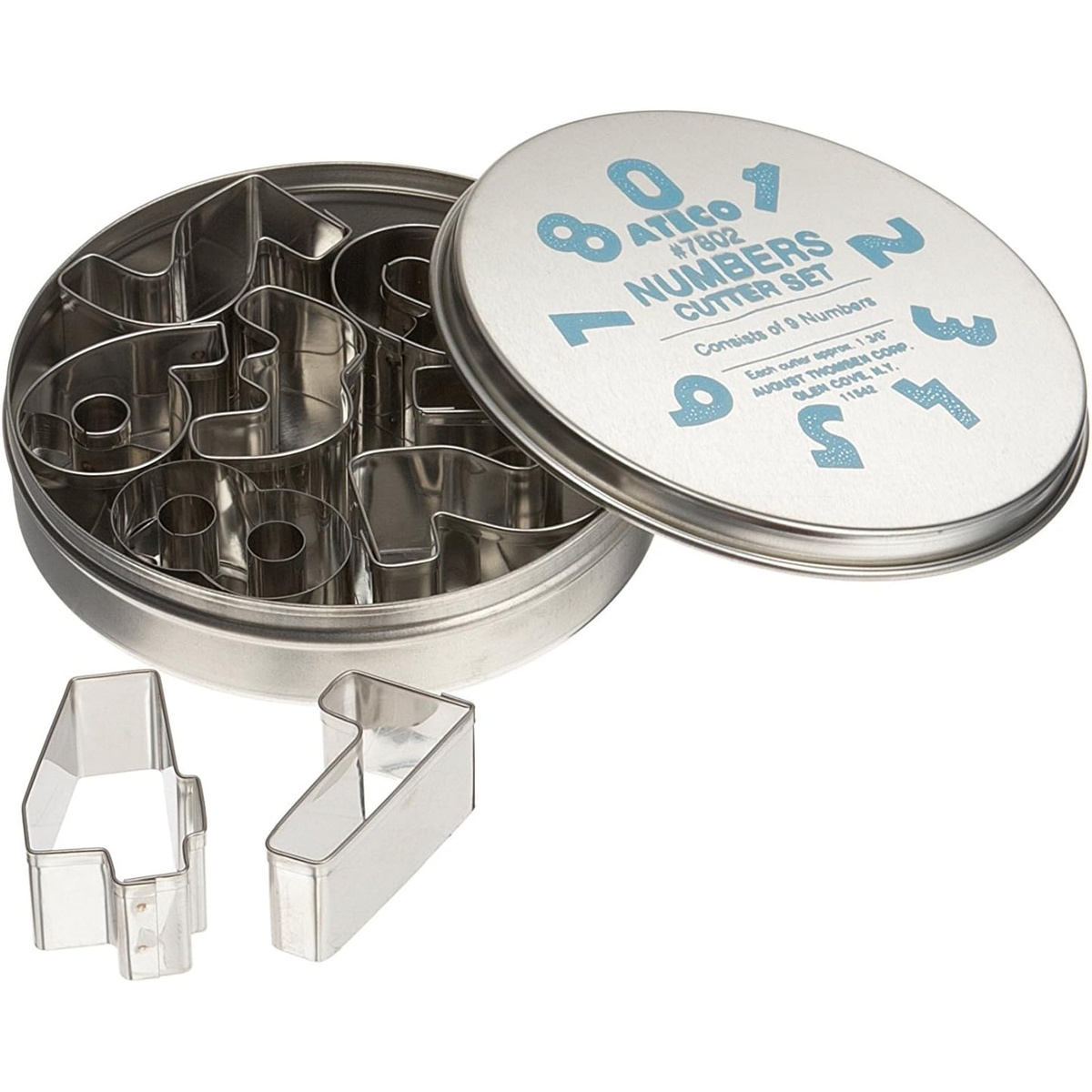 Ateco #7802 stainless steel number cutter set displayed in open round tin storage container with two cutters in foreground