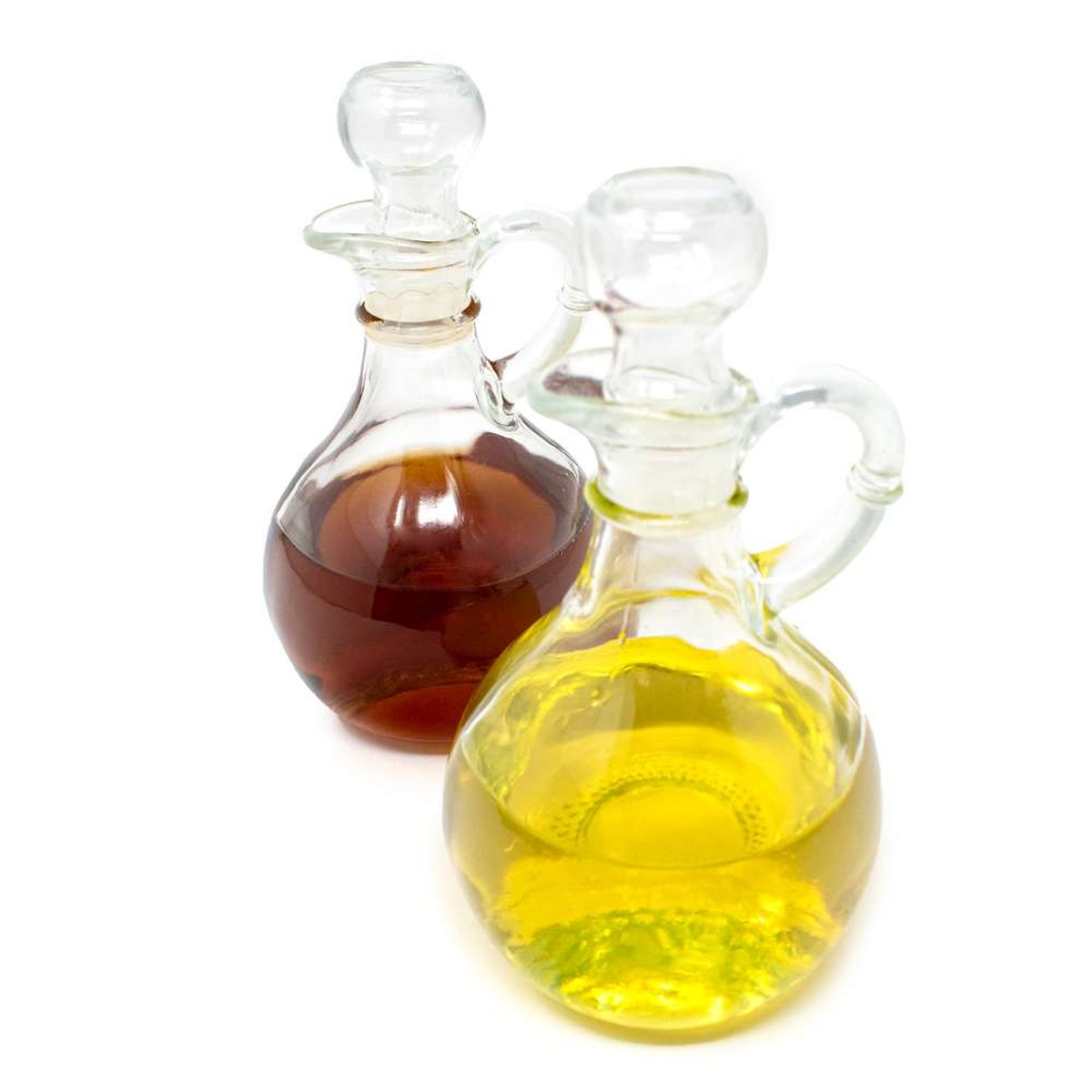 Two Norpro 794 glass cruets side by side, one filled with golden oil and one filled with red-brown vinegar