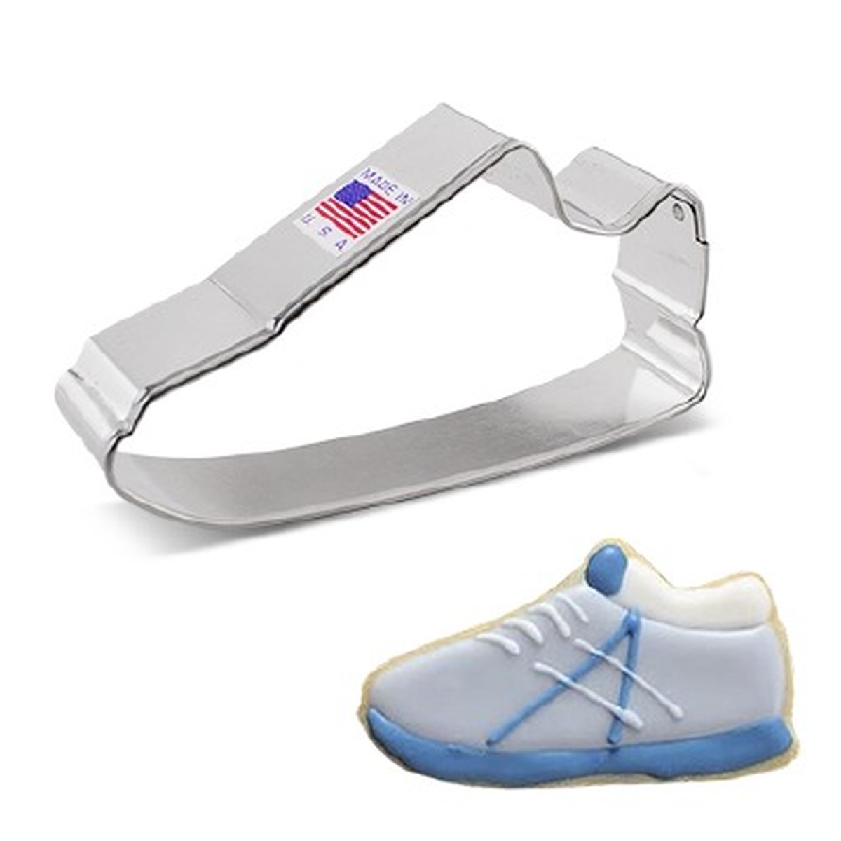 Metal sneaker-shaped cookie cutter shown alongside a finished decorated sneaker cookie in blue and white
