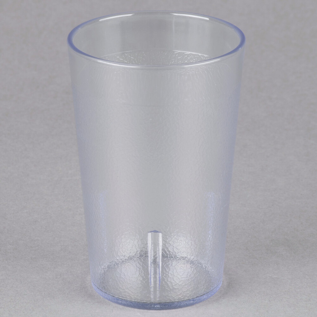 Cambro 800P152 clear 7.8 oz SAN plastic tumbler showing textured exterior and interior stacking lug