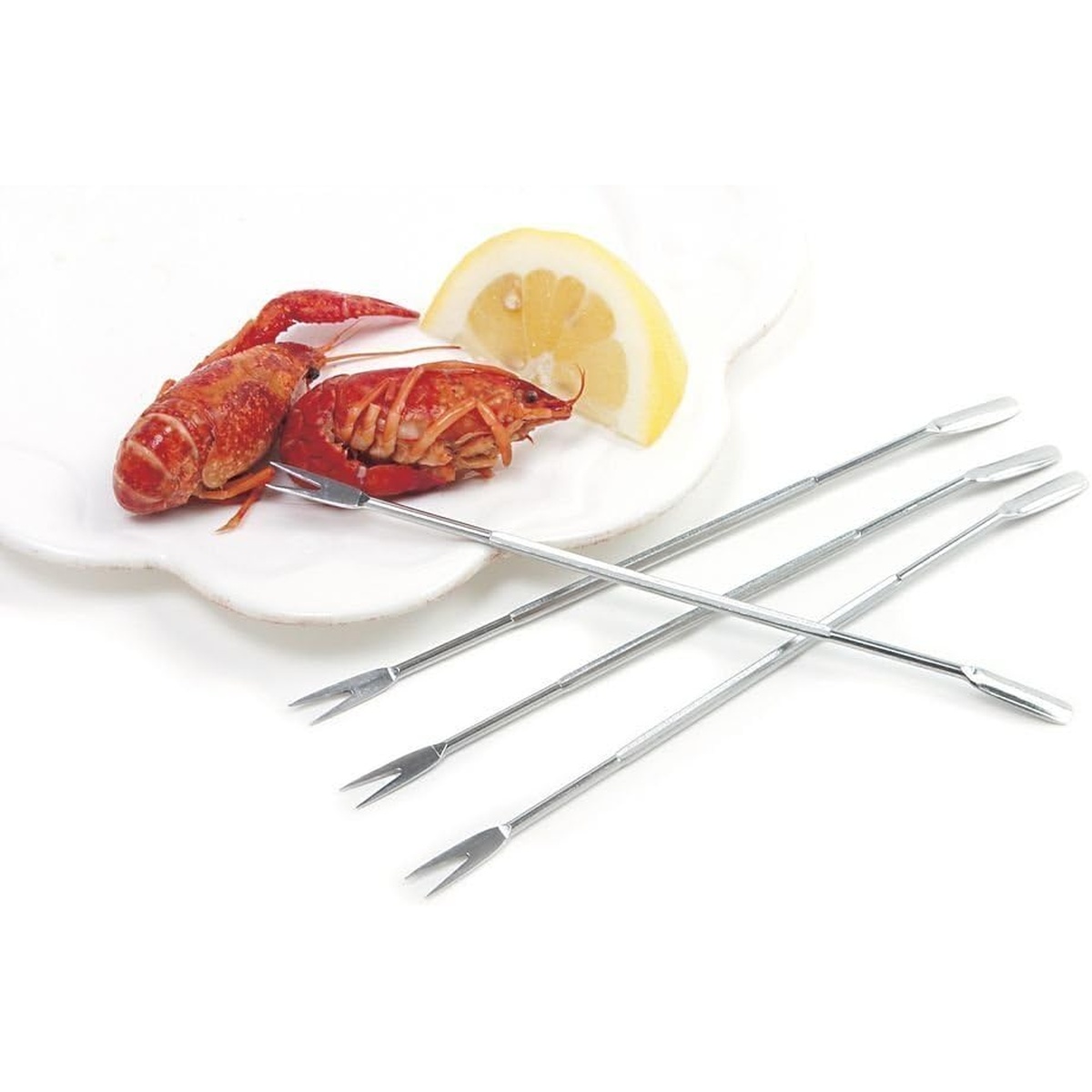 Seafood picks shown with crawfish and a lemon wedge on a white plate