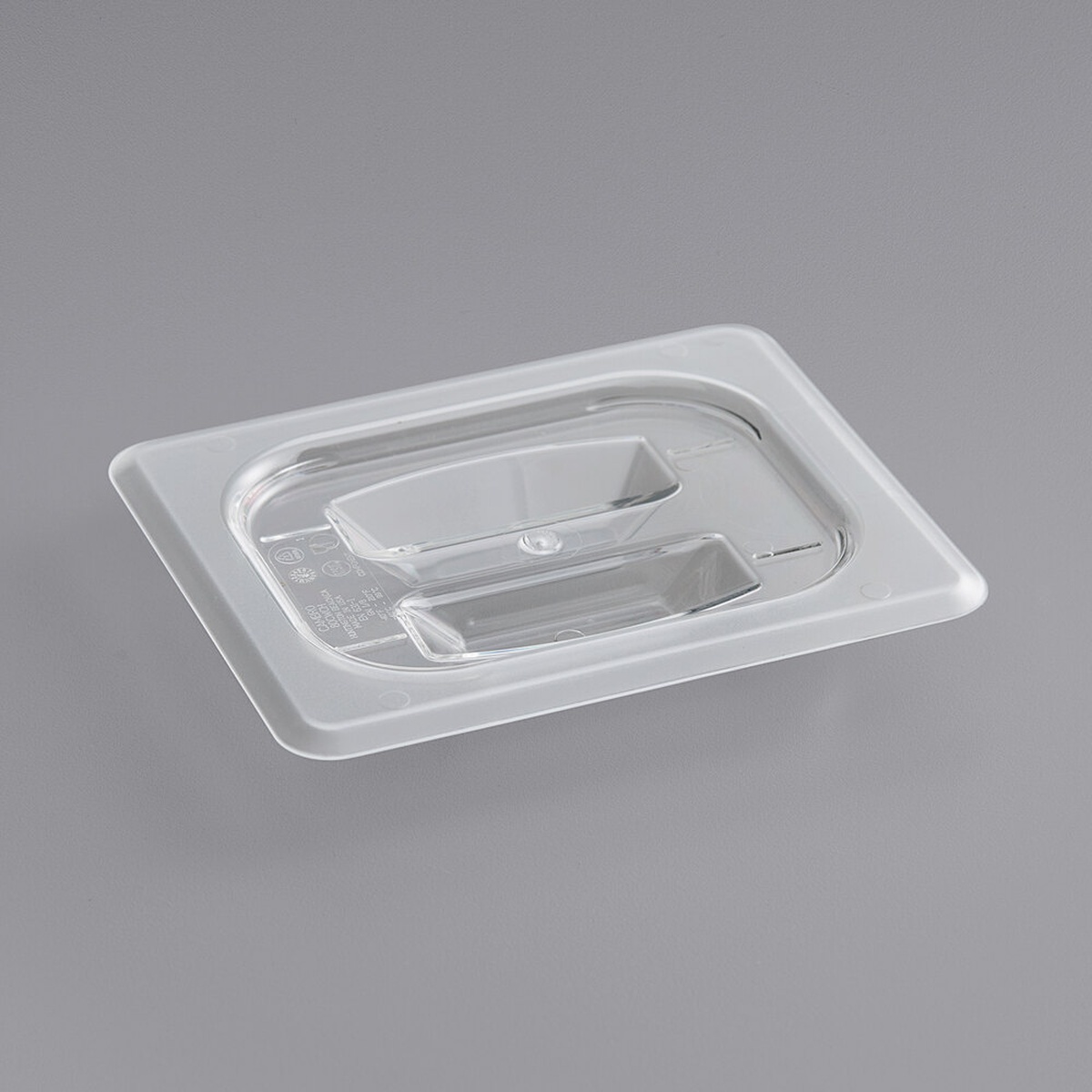 Cambro 80CWCH135 1/8 size clear polycarbonate handled lid shown from an angled view on a gray background