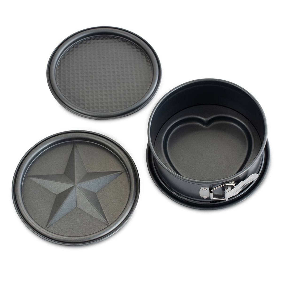 Nordic Ware 4-piece springform pan set showing springform ring assembled with heart disc, plus separate star-embossed and diamond-grid discs