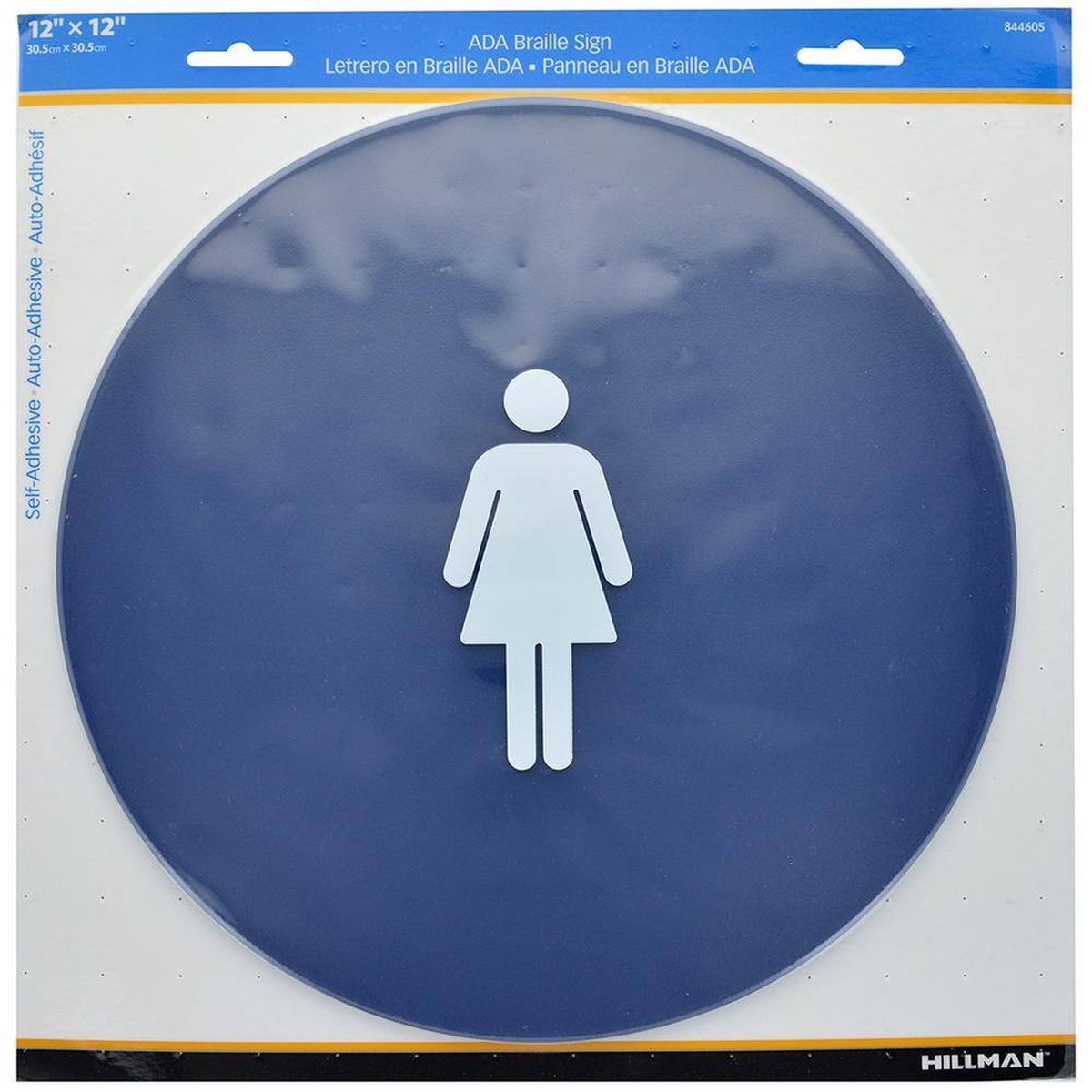 Hillman 844605 ADA Braille women's restroom sign shown in retail packaging, self-adhesive label visible