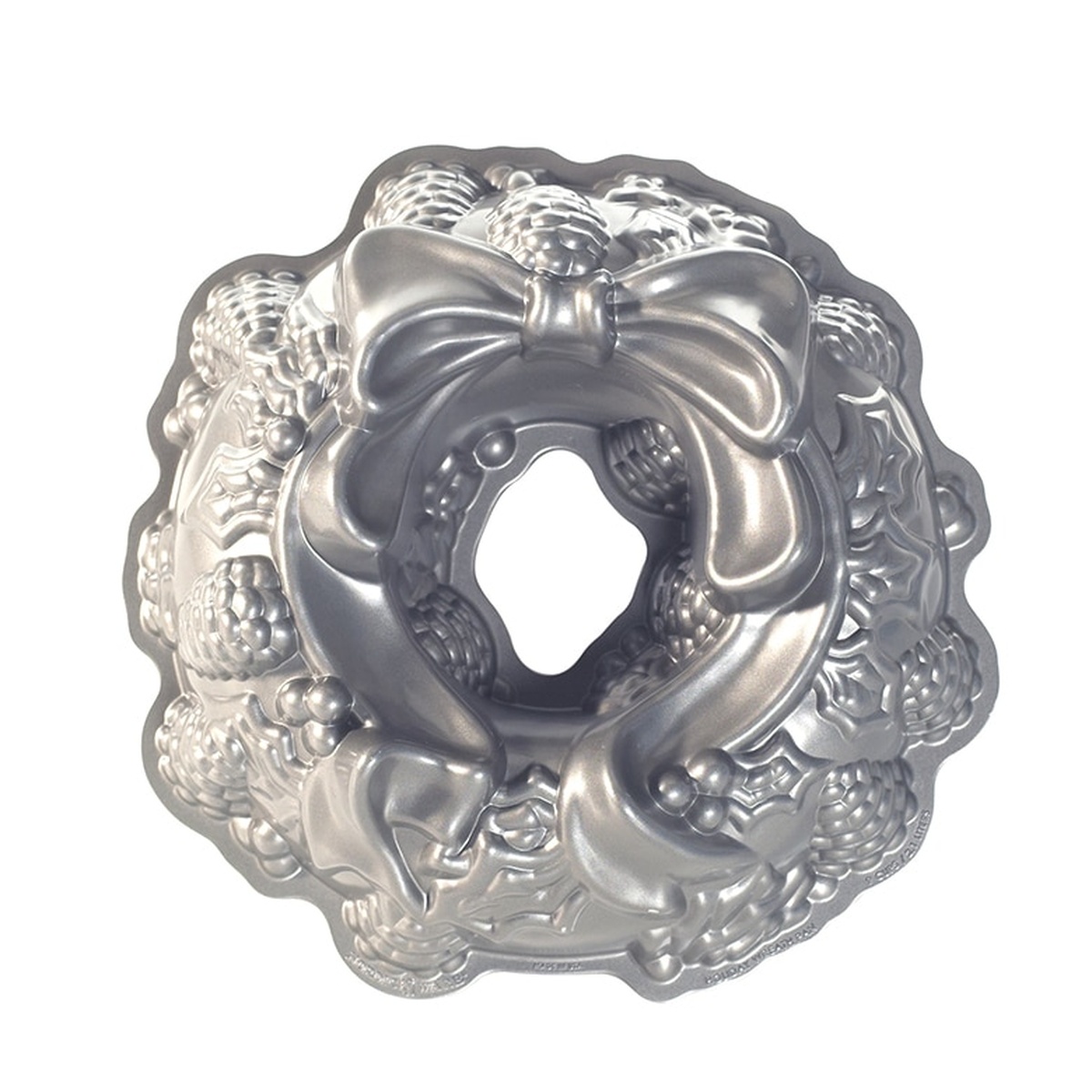 Nordic Ware Holiday Wreath Bundt Pan top view showing detailed pine cones, holly, berries, and bow design in silver cast aluminum