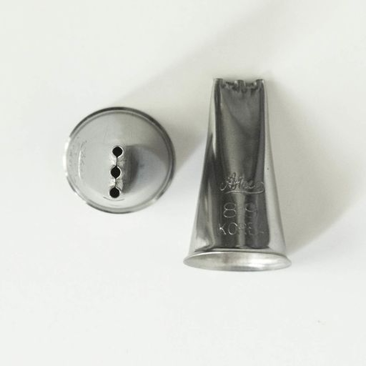 Ateco #89 three-line pastry tip shown from two angles: side profile and front view revealing three parallel openings