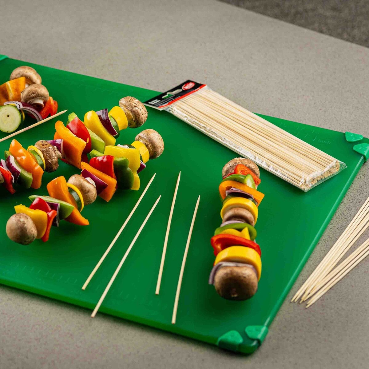 Bamboo skewers and vegetable kabobs shown from a side angle