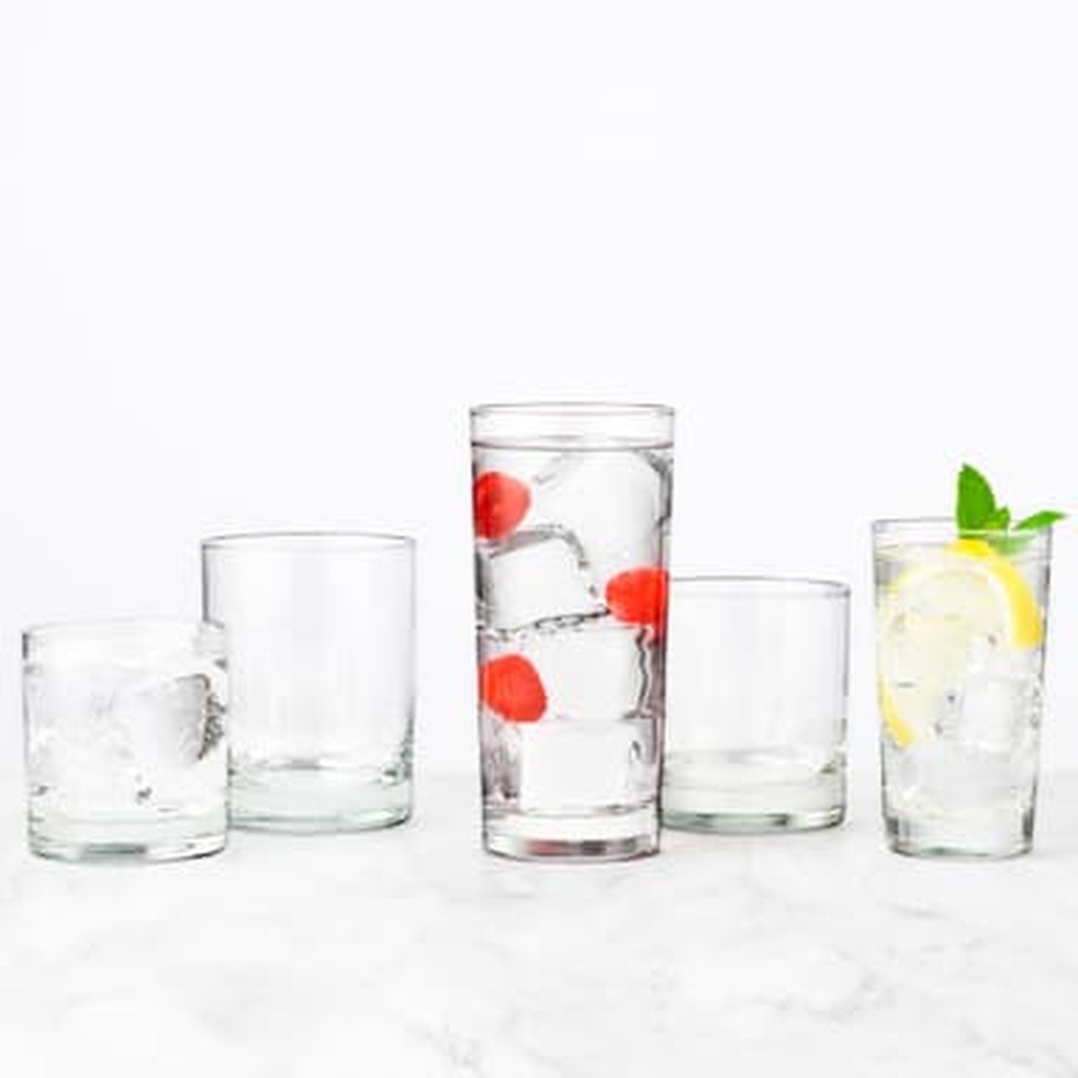 Libbey Heavy Base glassware collection including double old fashioned and highball glasses with colorful beverages