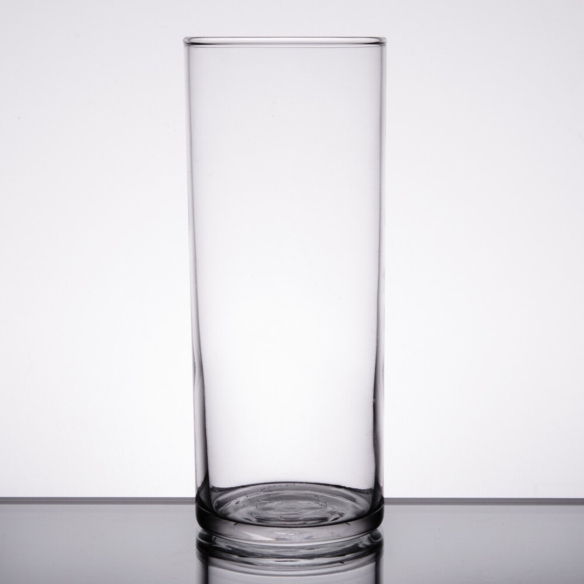 Libbey 95 straight-sided 11 oz zombie glass, clear cylindrical body with thick base on a reflective surface