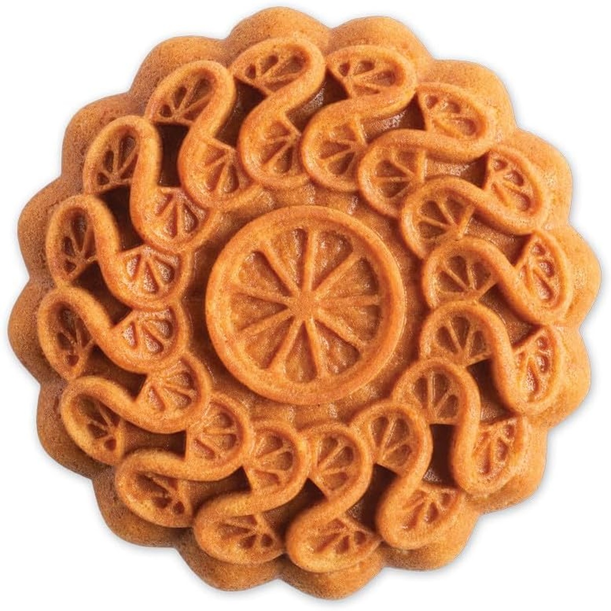 Baked cake released from the Nordic Ware Citrus Twist Pan showing crisp citrus slice and swirl pattern detail on the finished cake surface