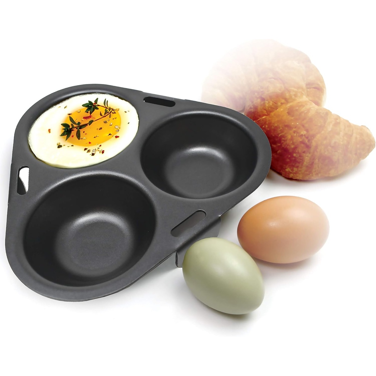 Norpro egg poacher with a perfectly poached egg and raw eggs on the side