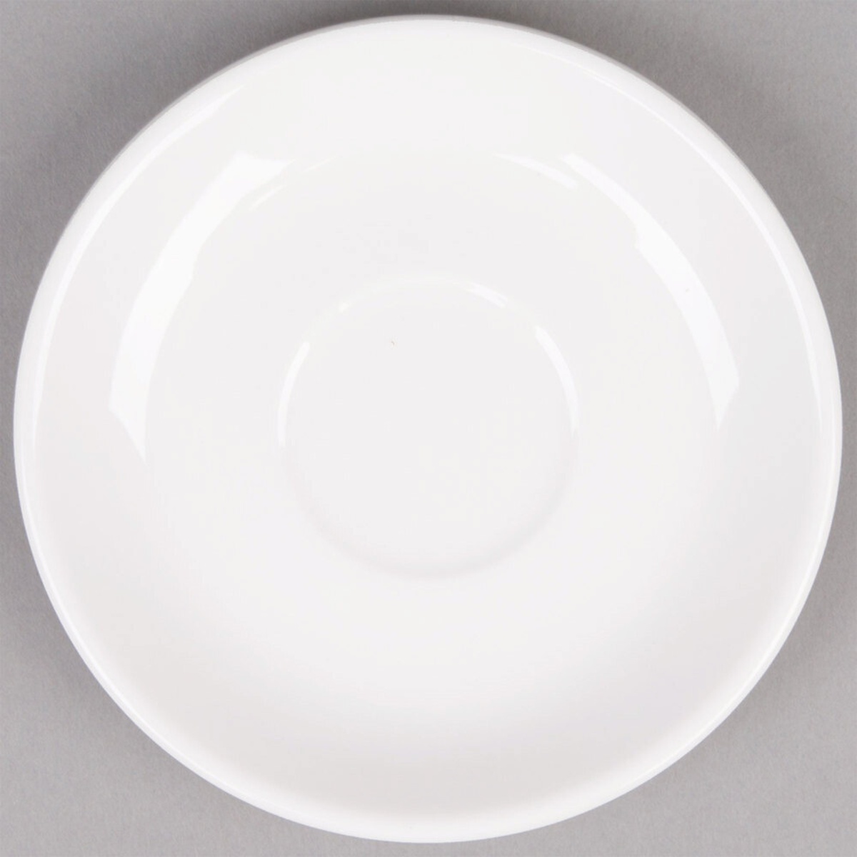 Tuxton ALE-050 Alaska 5-inch bright white china demitasse saucer, top-down view showing coupe shape and glossy finish