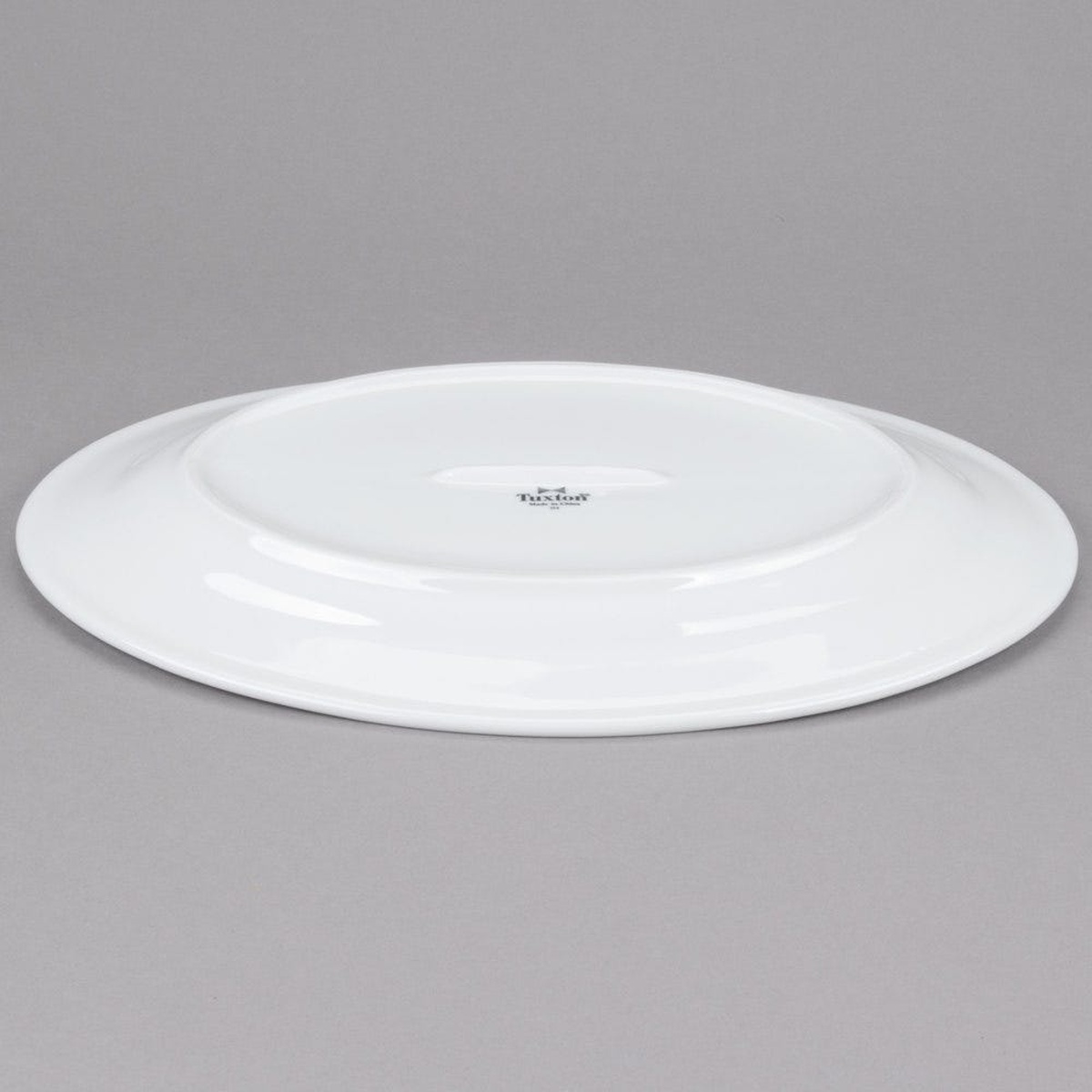 Tuxton ALH-160 oval platter underside showing Tuxton stamp and smooth vitrified base