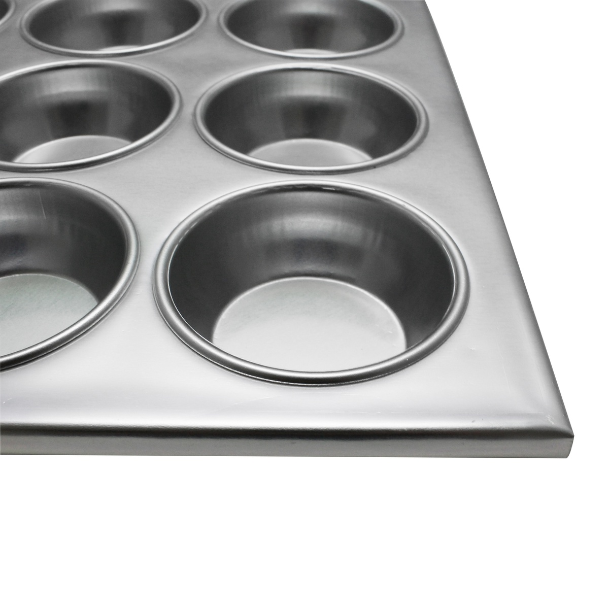 Close-up angled view of Thunder Group aluminum muffin pan showing smooth cup interiors and flat rim border