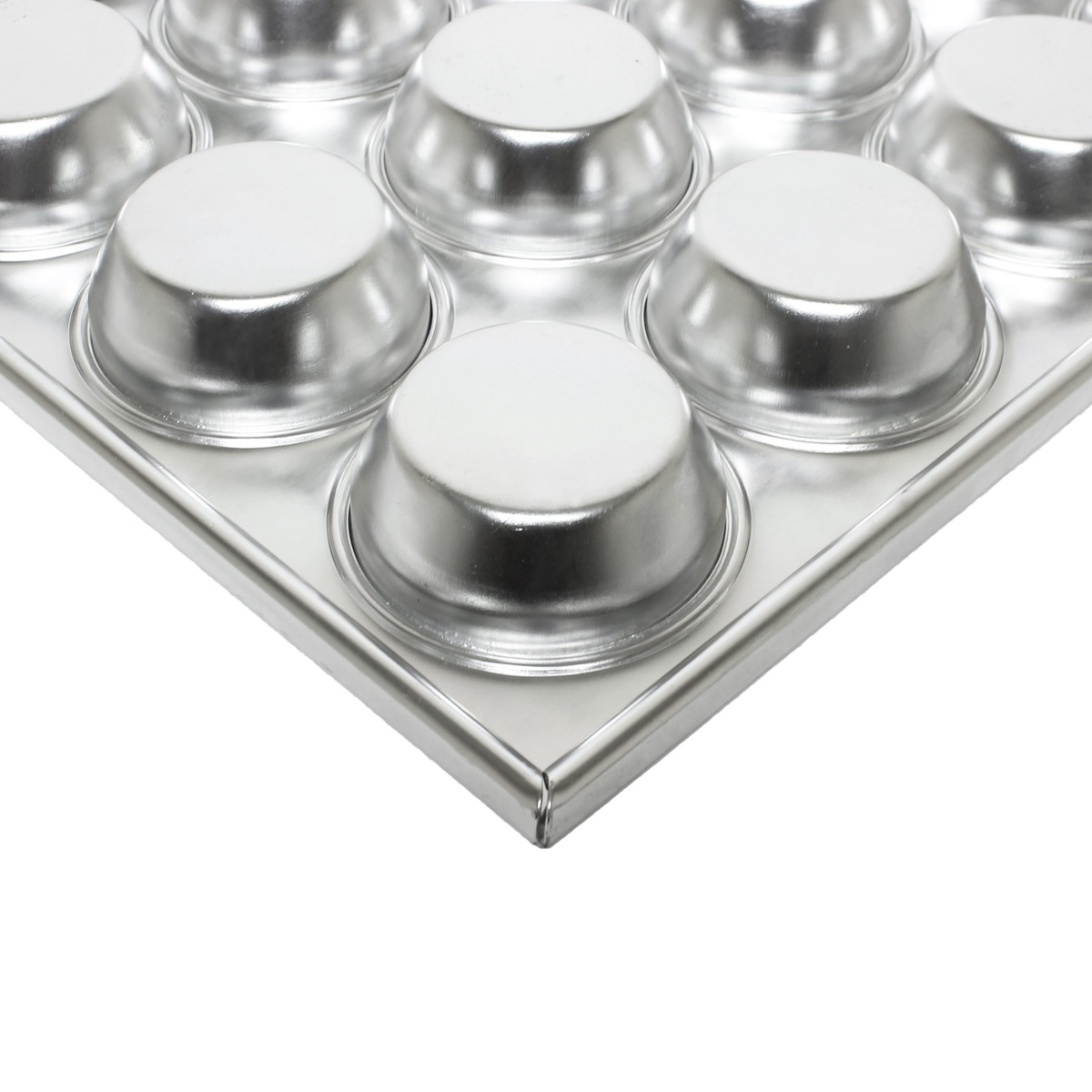 Corner close-up of Thunder Group aluminum muffin pan showing raised cup depth and reinforced rim edge detail